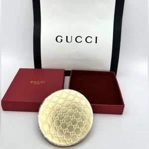 Gucci compact mirror.